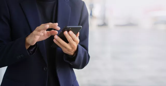 Business man checking phone