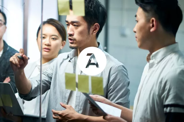 man drawing on glass