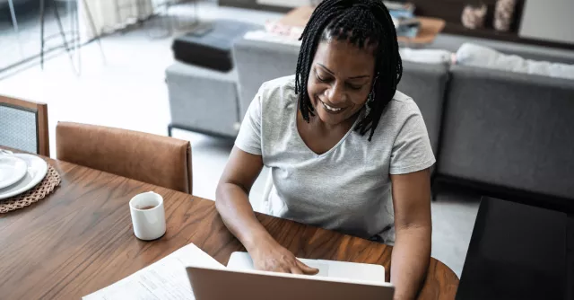 A woman works from her home