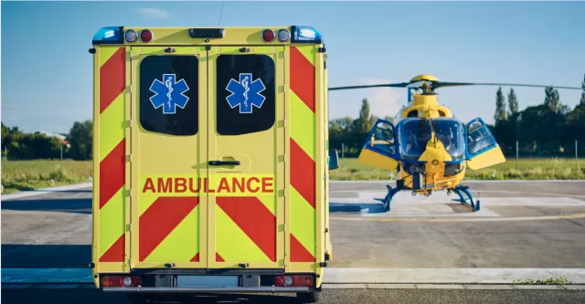 Ambulance next to a helicopter