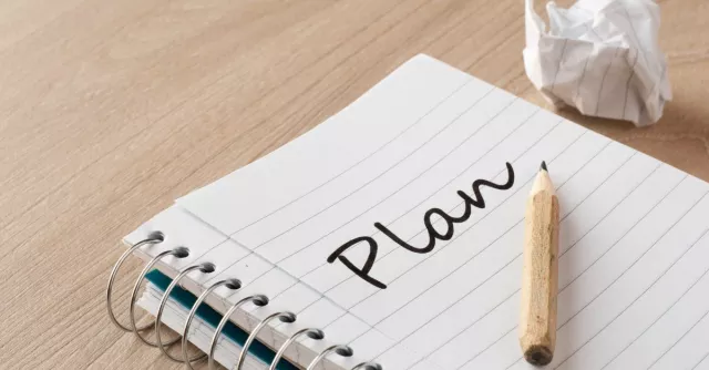 plan written on a notepad
