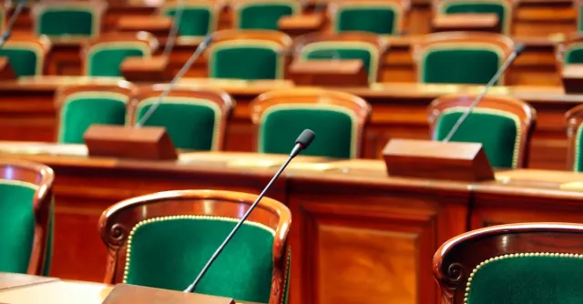 Empty seats at a legislative session