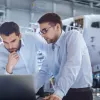Two men working on a computer