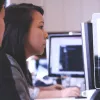 A woman works on a computer