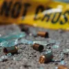 Bullet casings on ground with police tape