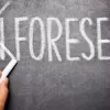 Unforeseen written on chalkboard